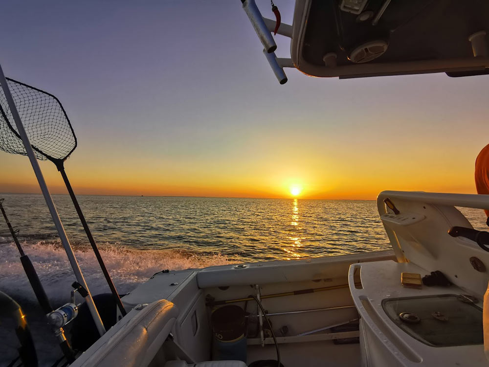 Boat sunset fishing siracusa Sicily
